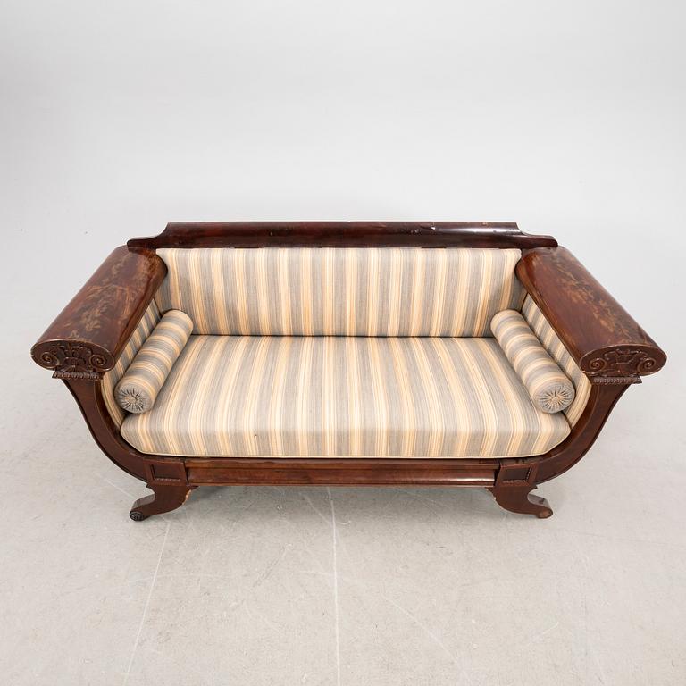 A mid 1800s late Empire mahogany sofa.