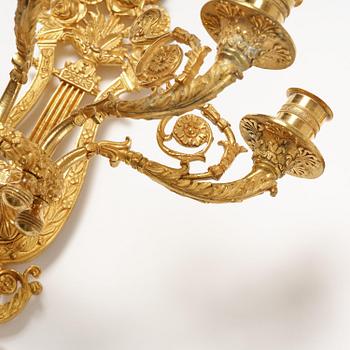 A pair of French 19th century gilt bronze five-light wall-lights.