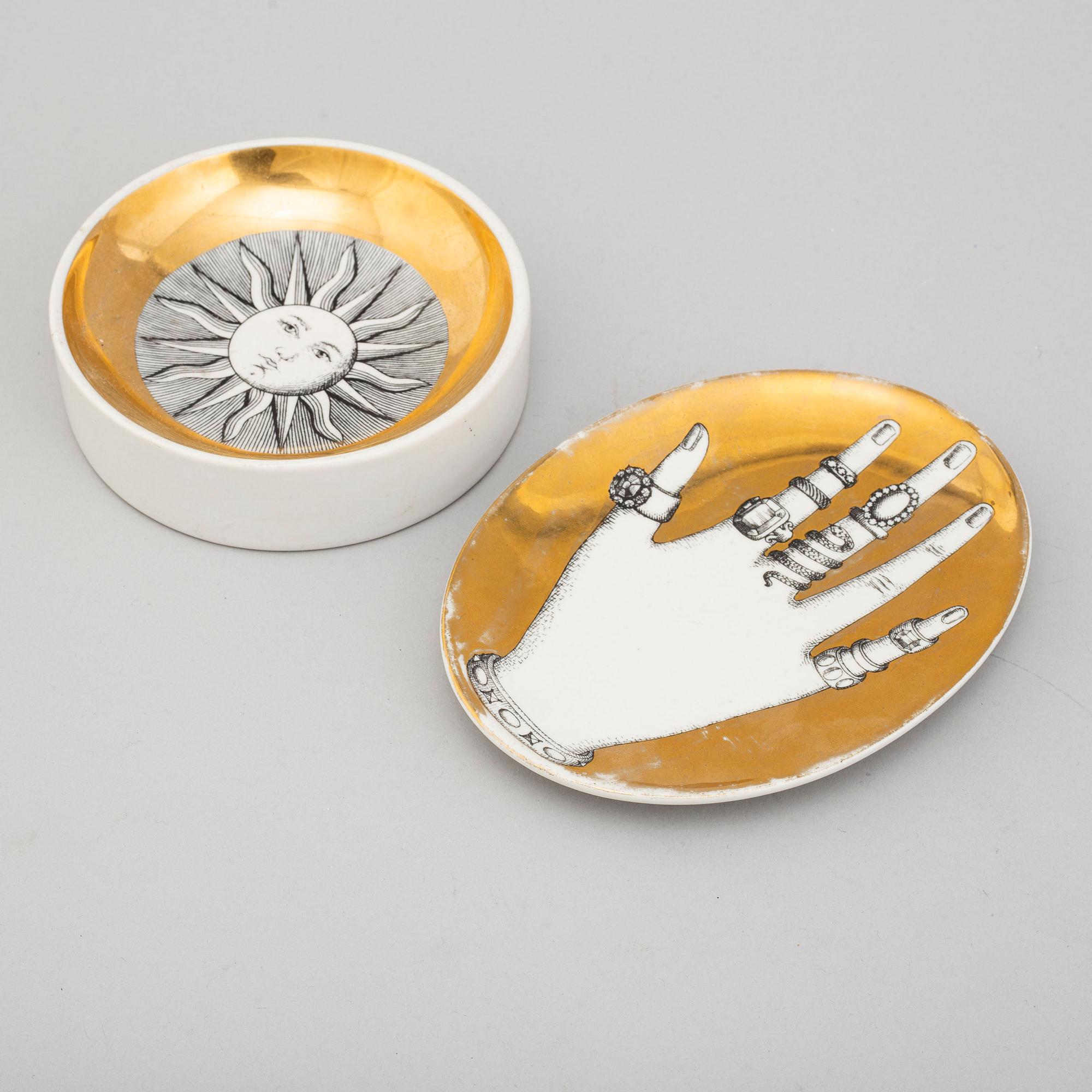 PIERO FORNASETTI, a porcelain ashtray, a jewelry dish and a pair of 'Botanica Pratica' bowls, Milan, Italy.