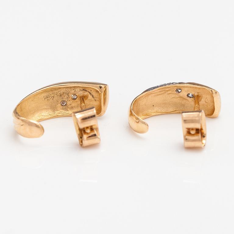 A pair of 14K ogld earrings with diaomnds ca. 0.036 ct in total. Finland 1992.