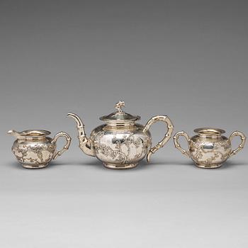 714. A Chinese export silver three-piece tea service, mark of Luen Wo, Shanghai, circa 1880-1925.