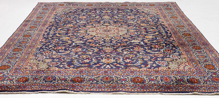 An oriental carpet, c. 390 x 295 cm.