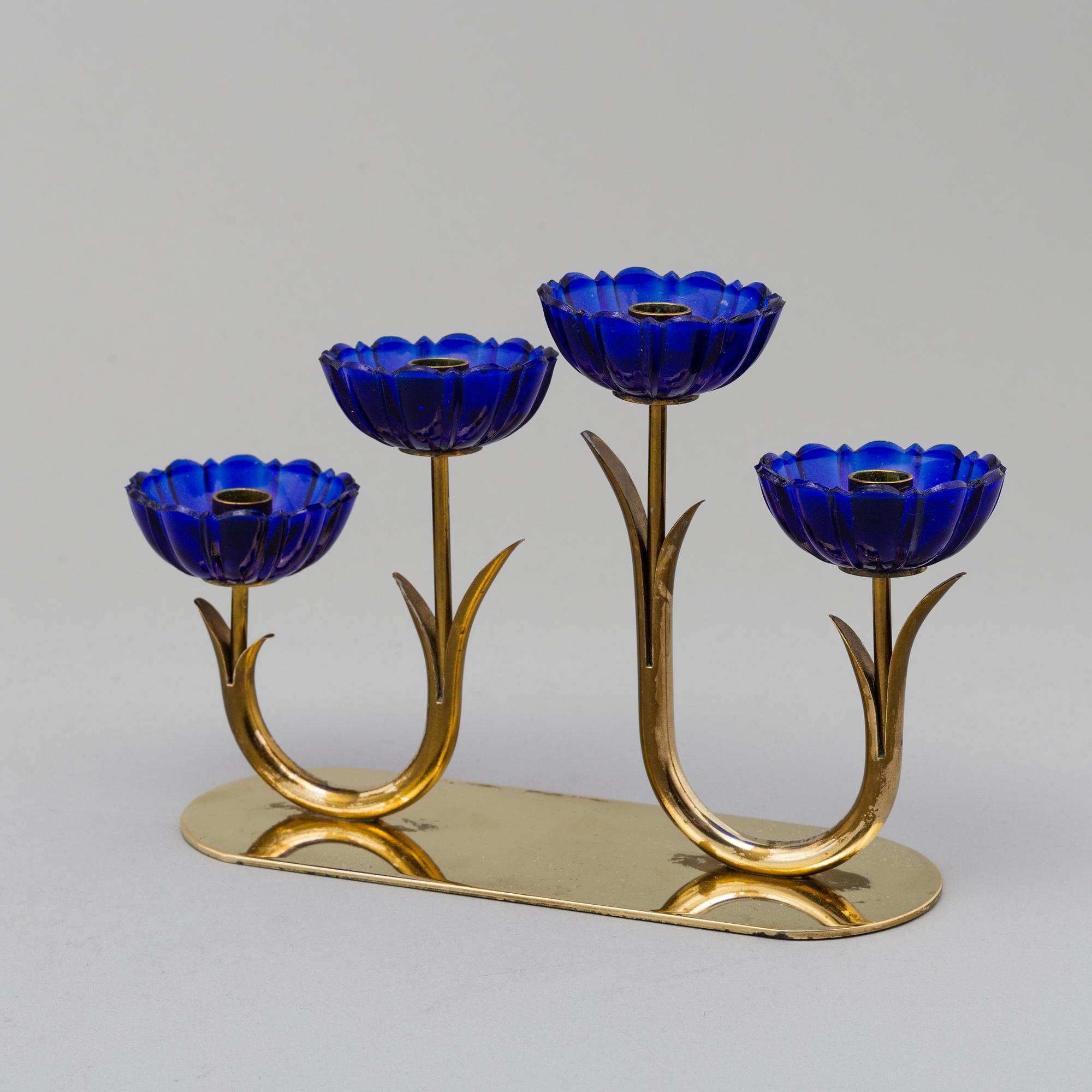 GUNNAR ANDER, 8 brass candlesticks. Ystad Metall, mid 20th century.