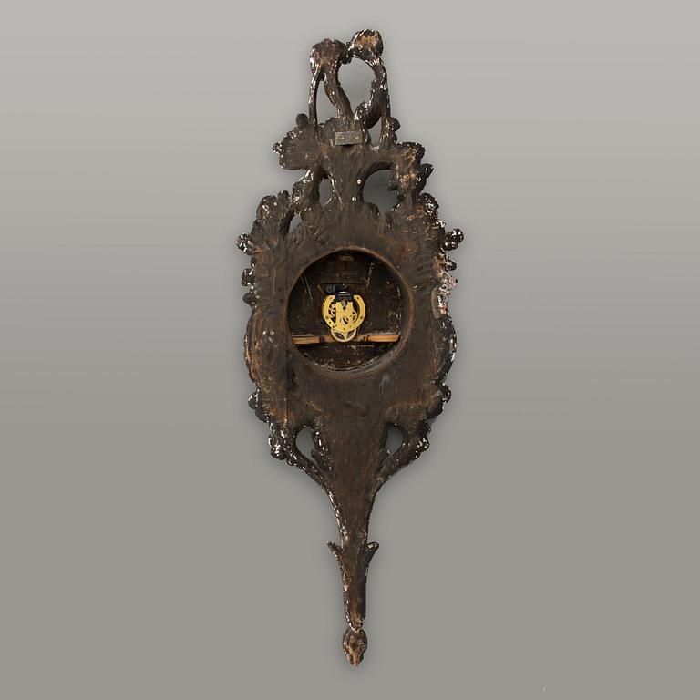 A 18th century wall clock.