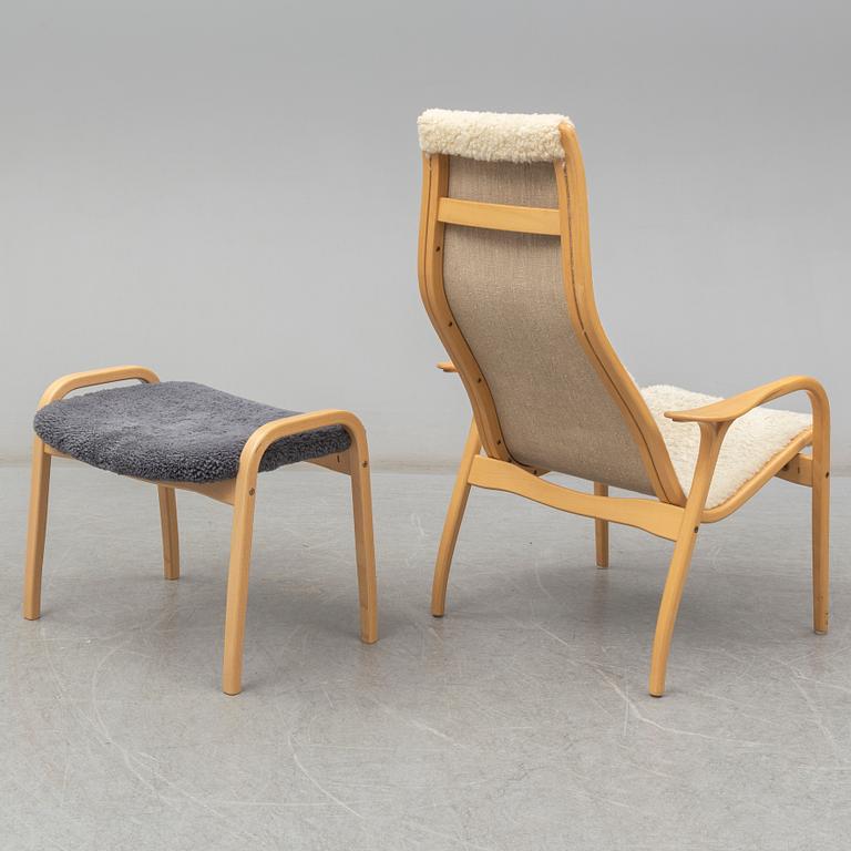 a 'Lamino' armchair with a stool by Yngve Ekström for Swedese.