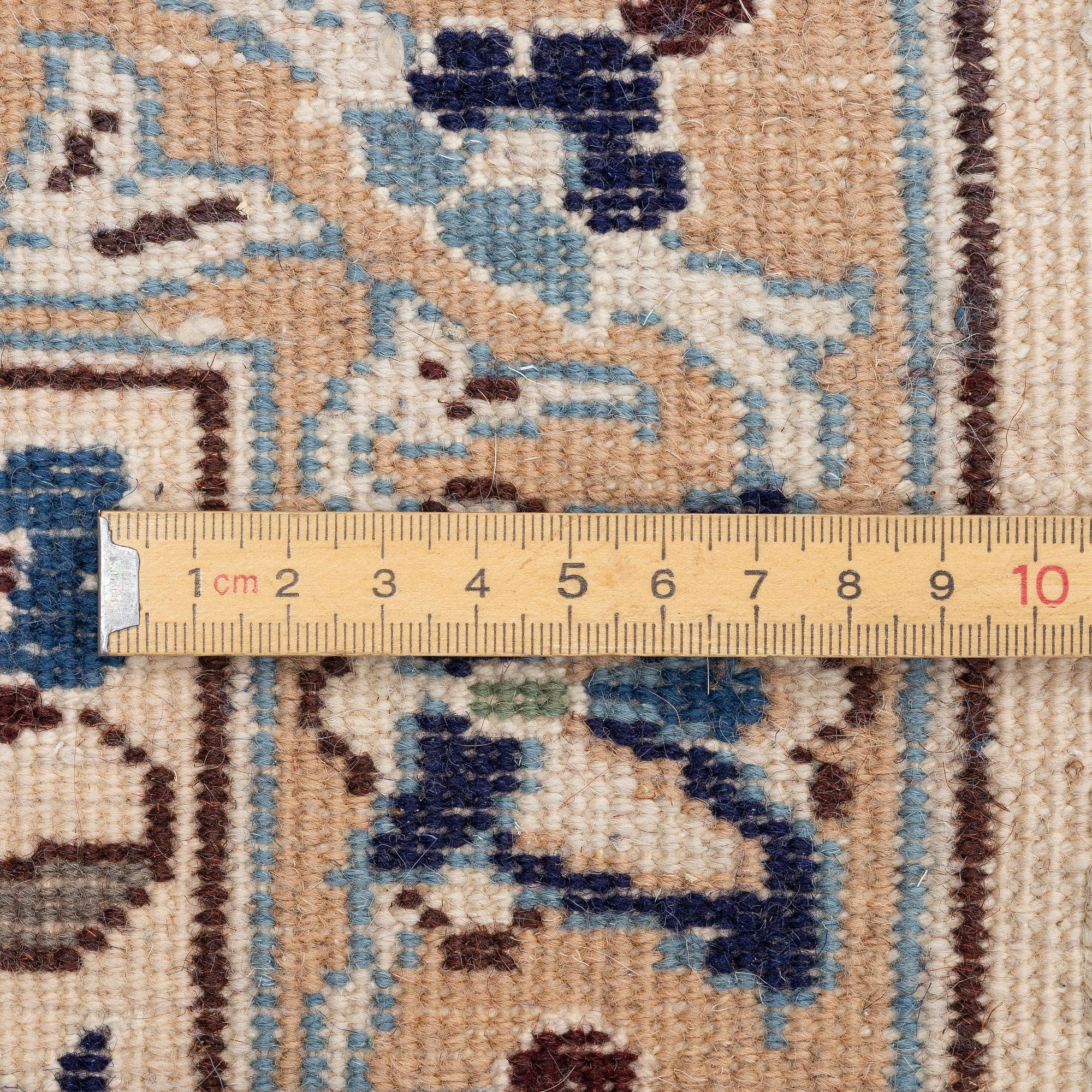 A Nain carpet, c. 310 x 195 cm.