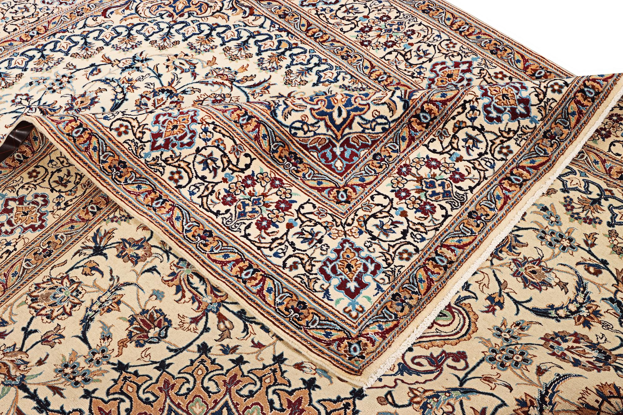 A Nain carpet, 9 laa, part silk, Iran, c. 335 x 245 cm.