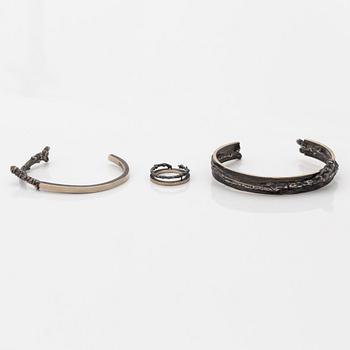 Two Copula silver bracelets and a ring.