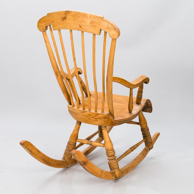 A Wooden Rocking Chair.