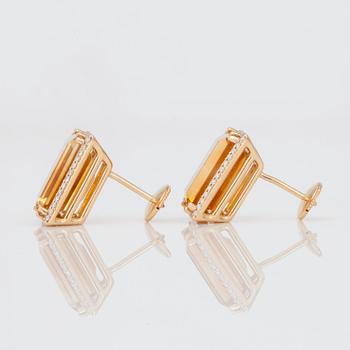 A pair of diamond and citrine earrings.