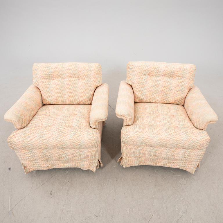 A pair of DUX 1960770s armchairs.