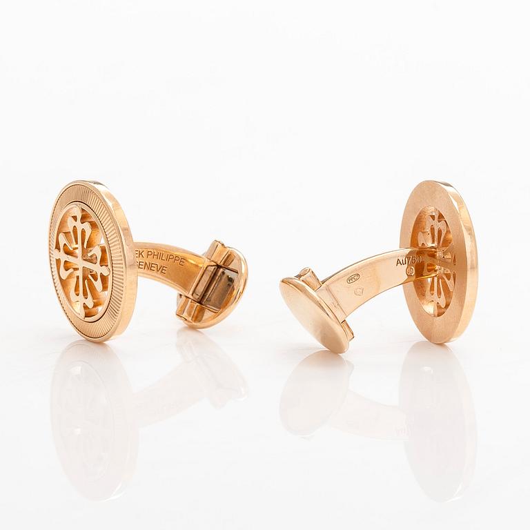 Patek Philippe, a pair of 18K gold "Calatrava" cufflinks.