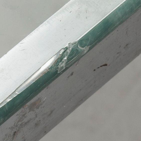 A TOBIA SCARPA GLASS TOP SOFA TABLE.