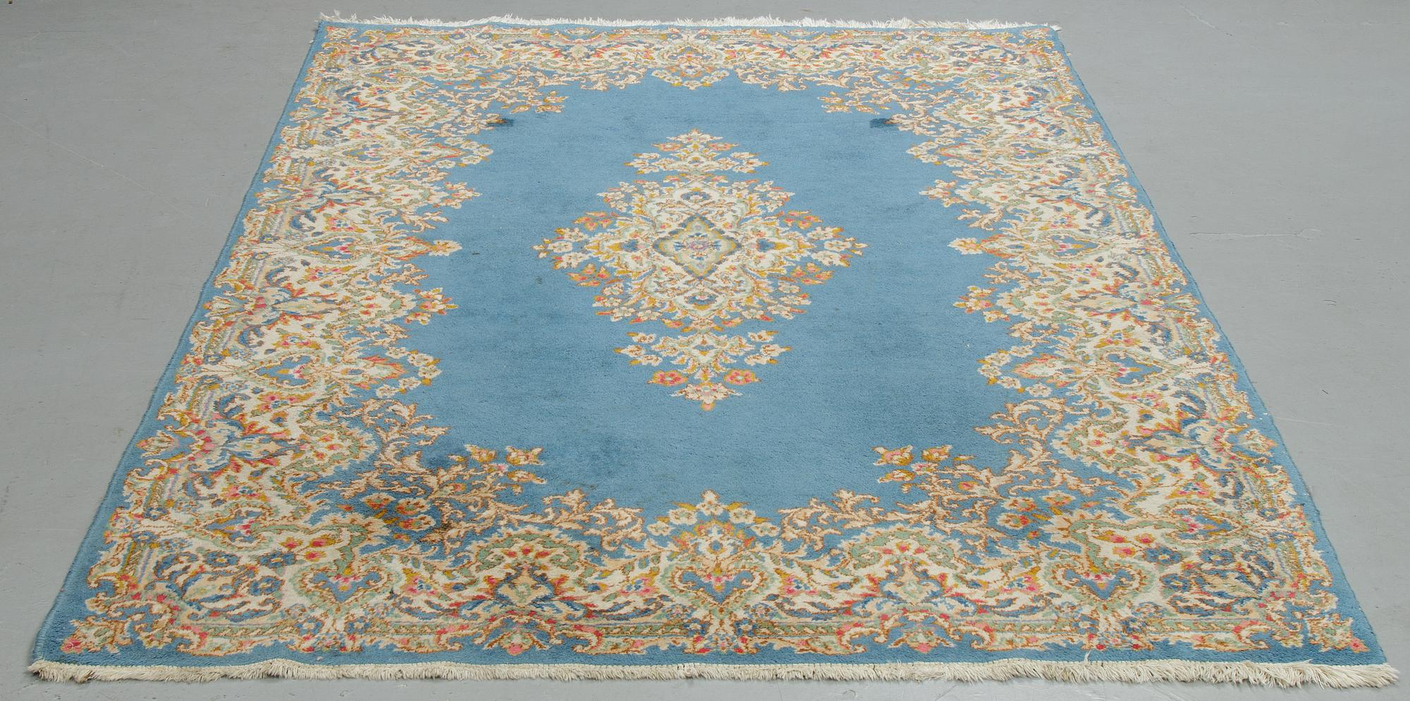 Matto, a semi-antique/an old Kerman, ca 270,5-272,5 x 182-183 cm.