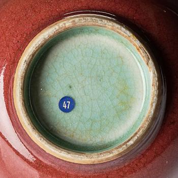 A red glazed bowl, Qing dynasty, 18th century.