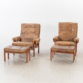 A pair of 1970/80:s easy chairs with stools.