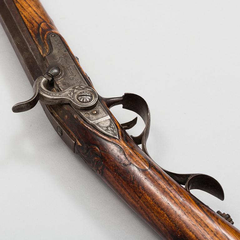 a 18th century rifle later made in to a percussion rifle signed by Lars Rånge, Jönköping.