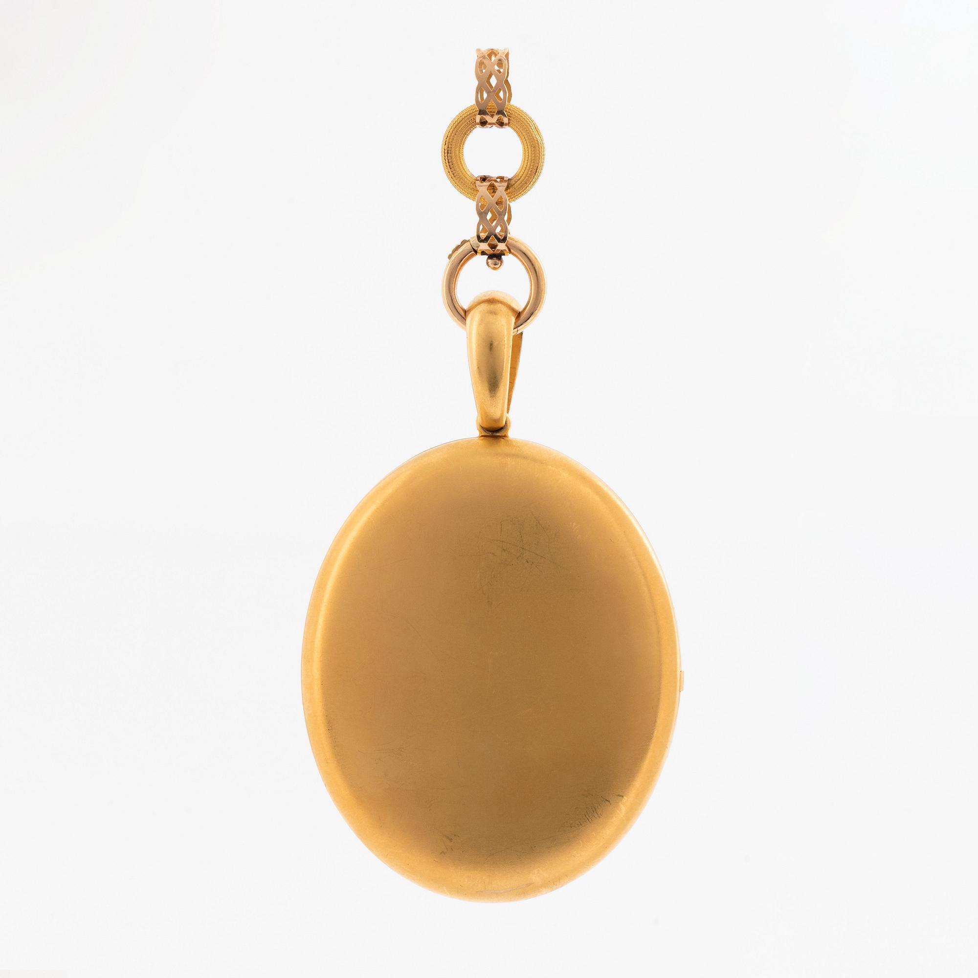 A gold locket with chain.