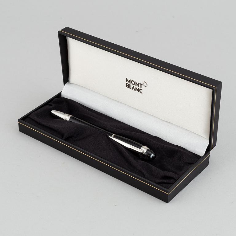 MOntblanc, a ball point pen and leather passport holder.