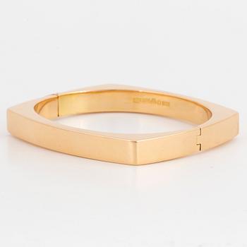 A Gaudy bangle in 18K gold.