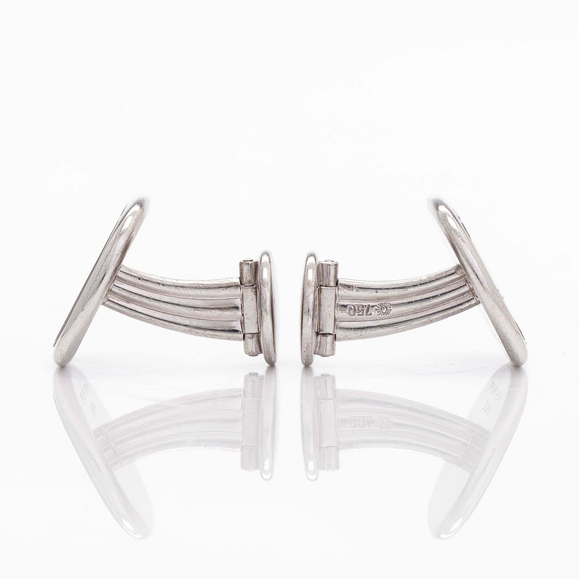 Patek Philippe, a pair of 18K whitegold 'Calatrava' cufflinks.