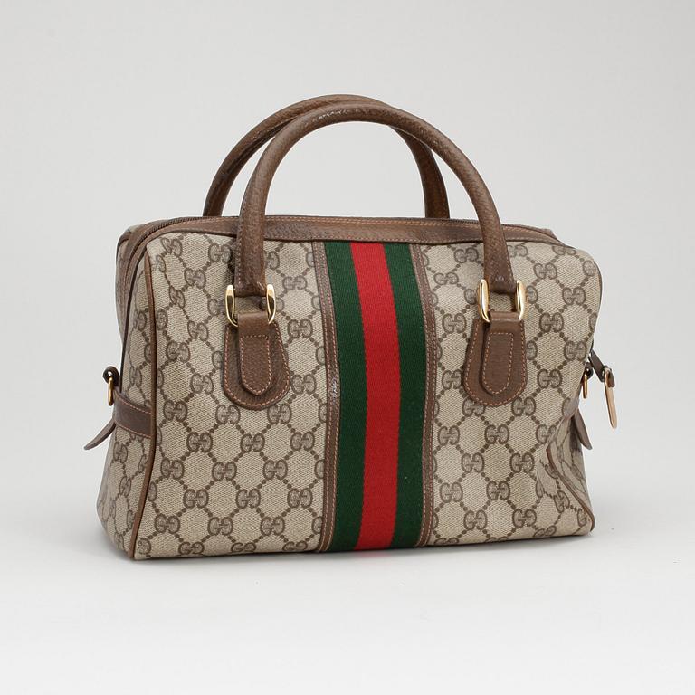 GUCCI, a monogram canvas handbag.