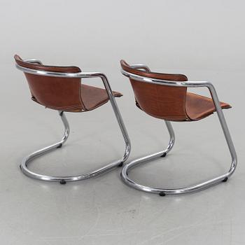 A pair of Willy Rizzo chairs.