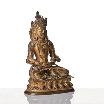 A gilt copper alloy figure of Amitayus, Tibeto - Chinese, 17th/18th century.