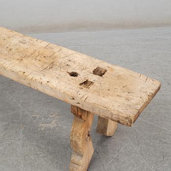 A 19th century folk art bench.