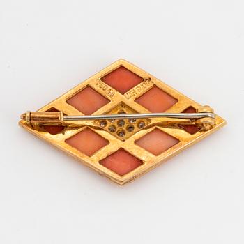 Coral and brilliant-cut diamond brooch.