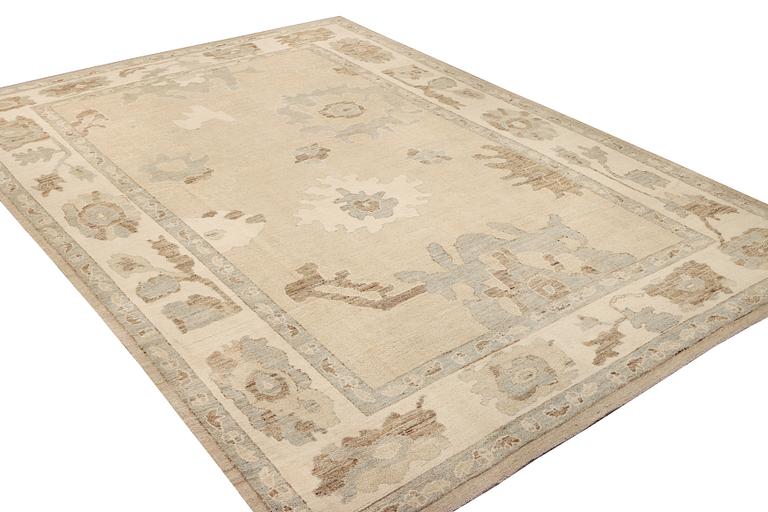 An Ushak design carpet, a. 426 x 307 cm.