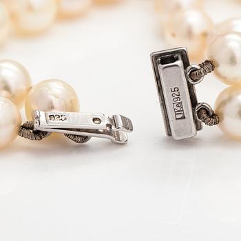 A pearl collier and two-strand pearl bracelet with cultured pearls and sterling silver.