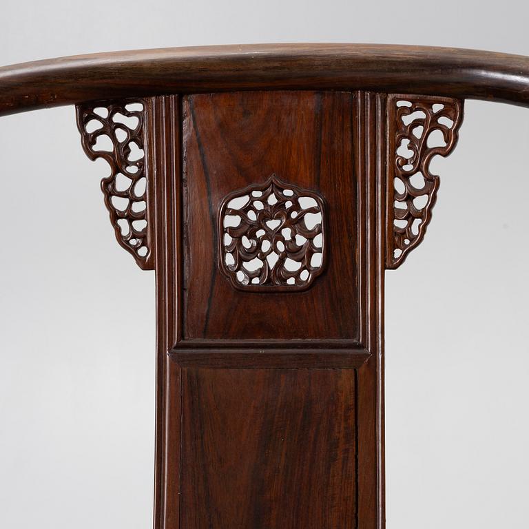 A pair of Chinese horseshoe-back hardwood armchairs, 1900s.