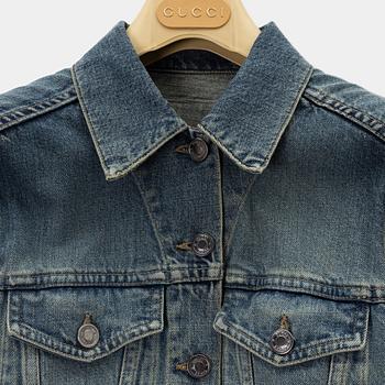 Gucci, a jeans jacket size 38.
