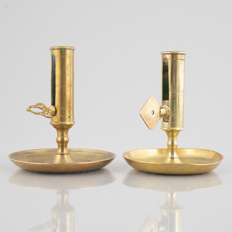 Six brass night candle sticks, 19th century.