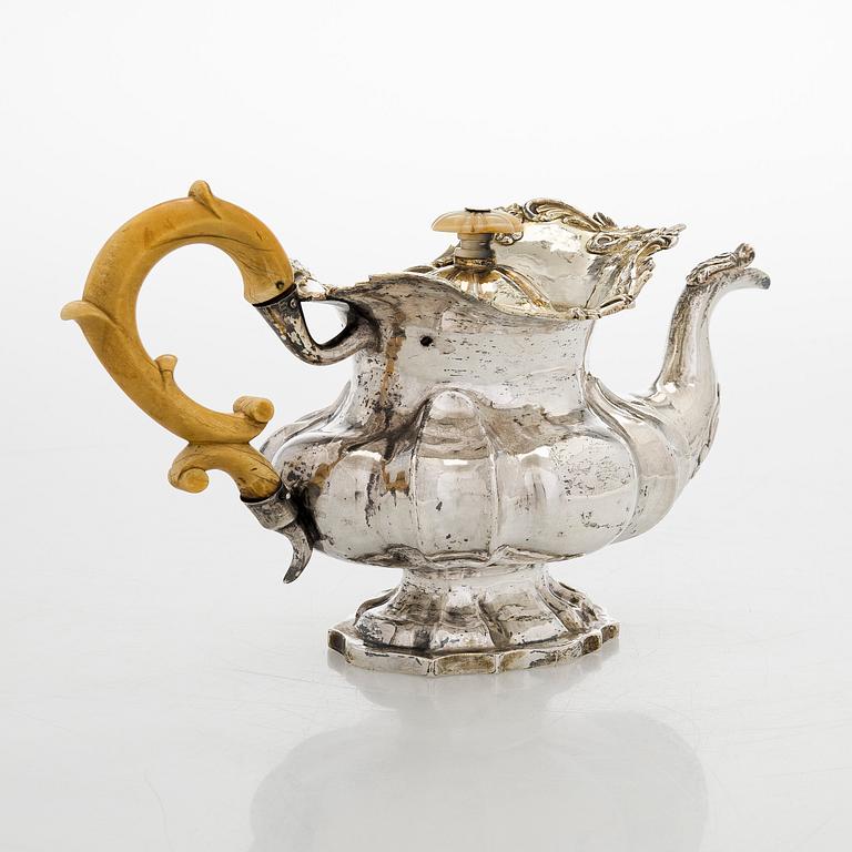 A parcel-gilt silver teapot, Moscow 1845.