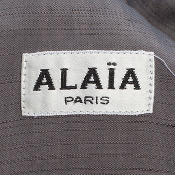 ALAÏA, a grey dress.