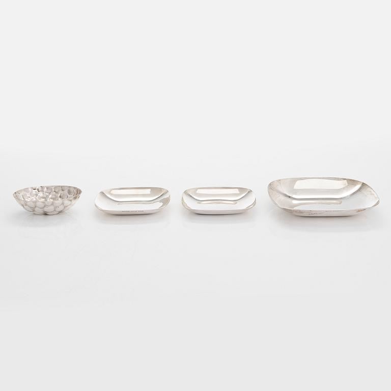 Tiffany & Co MAKERS, a four piece set of sterling silver bowls, salt and pepper shakers by other maker.