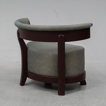 A contemporary 'Chelsea' armchair by Romeo Sozzi for Promemoria Furniture.