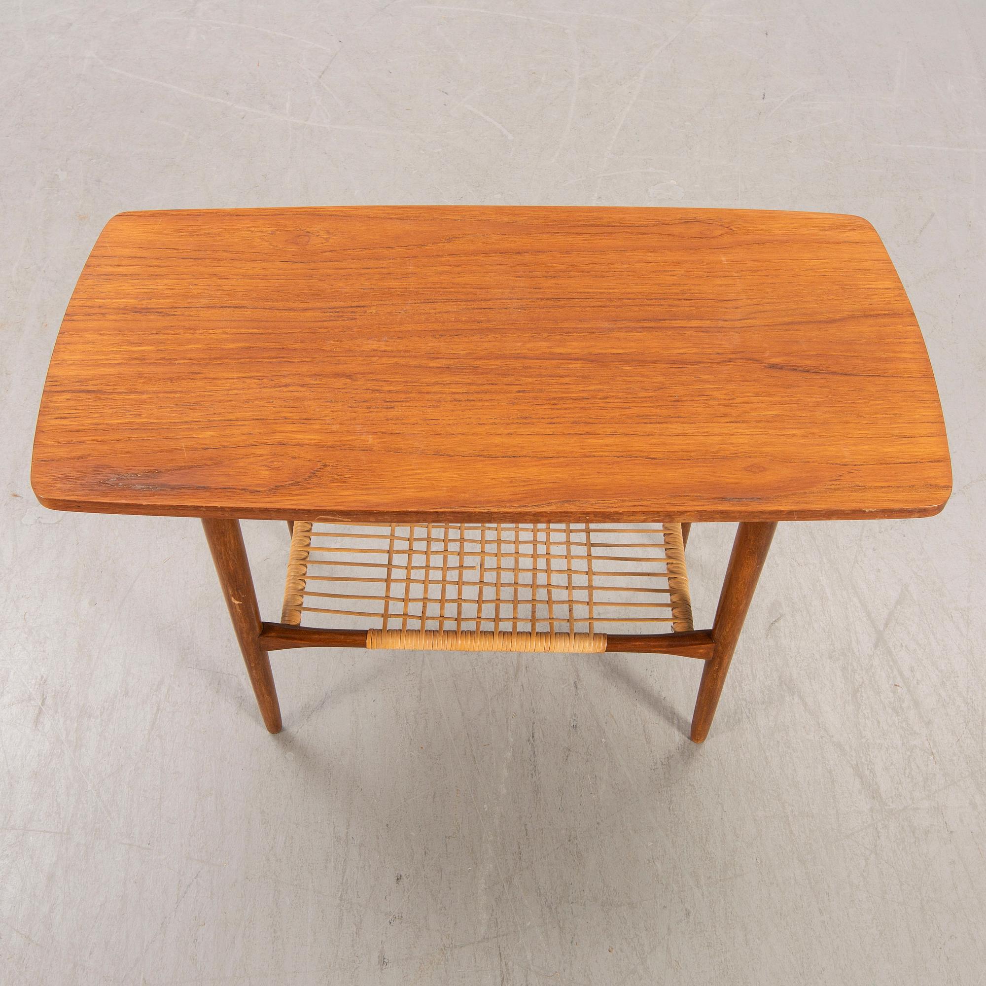 A teak and rattan 1960s coffee table.