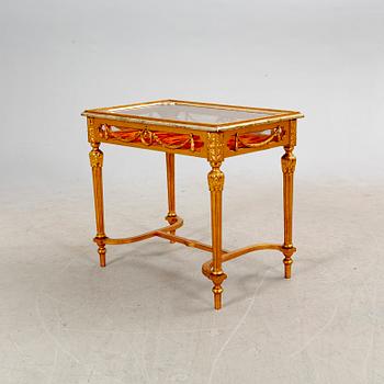 A gilded Louis XVI style display table first half of the 20th century.