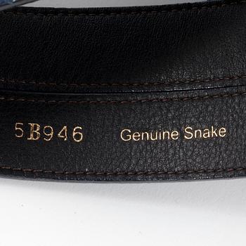 OSCAR DE LA RENTA, a blue snakeskin belt.