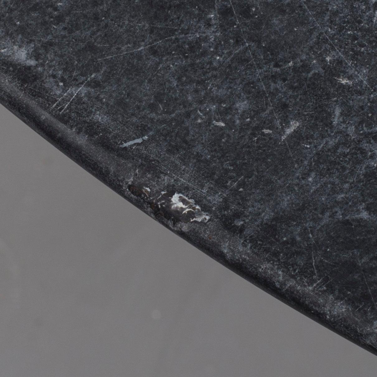 AN EERO SAARINEN "TULIP" TABLE BY KNOLL INTERNATIONAL.