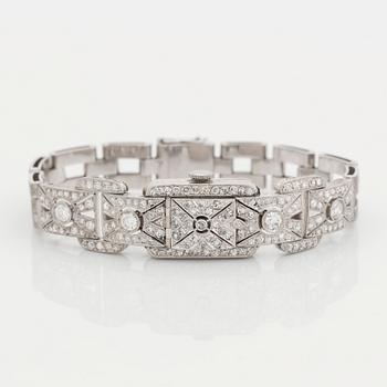 510. A bracelet/watch in platinum and 18K white gold set with old- and eight-cut diamonds.