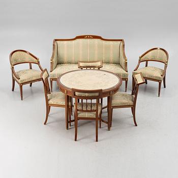 A sofa, two armchairs, four chairs and table, Empire style, 20th century.