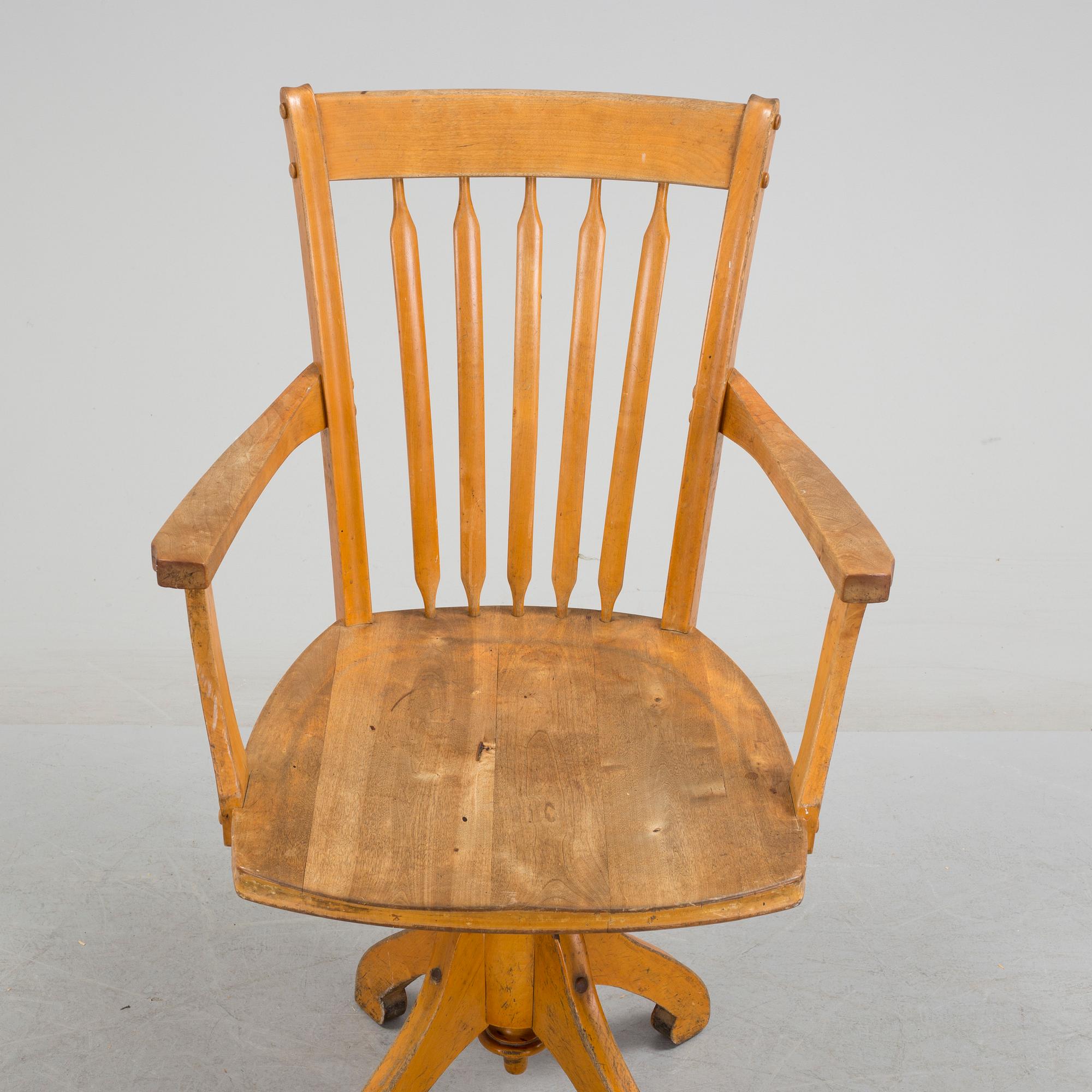 a writing desk chair from the early 20th century.