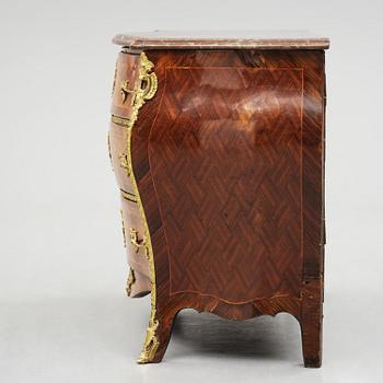 A parquetry and ormolu mounted rococo commode attributed to C. Tietze (master in Stockholm 1764.91).