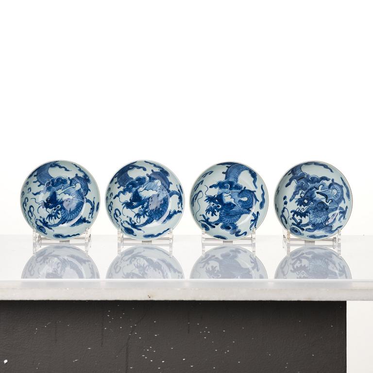 A set of four blue and white dragon dishes, Qing dynasty, 18th Century.