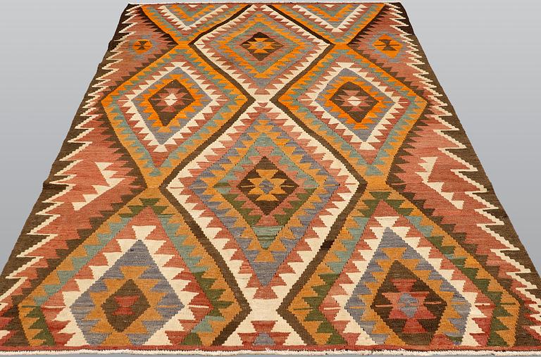 A kurdish kilim carpet, ca 310 x 173 cm.