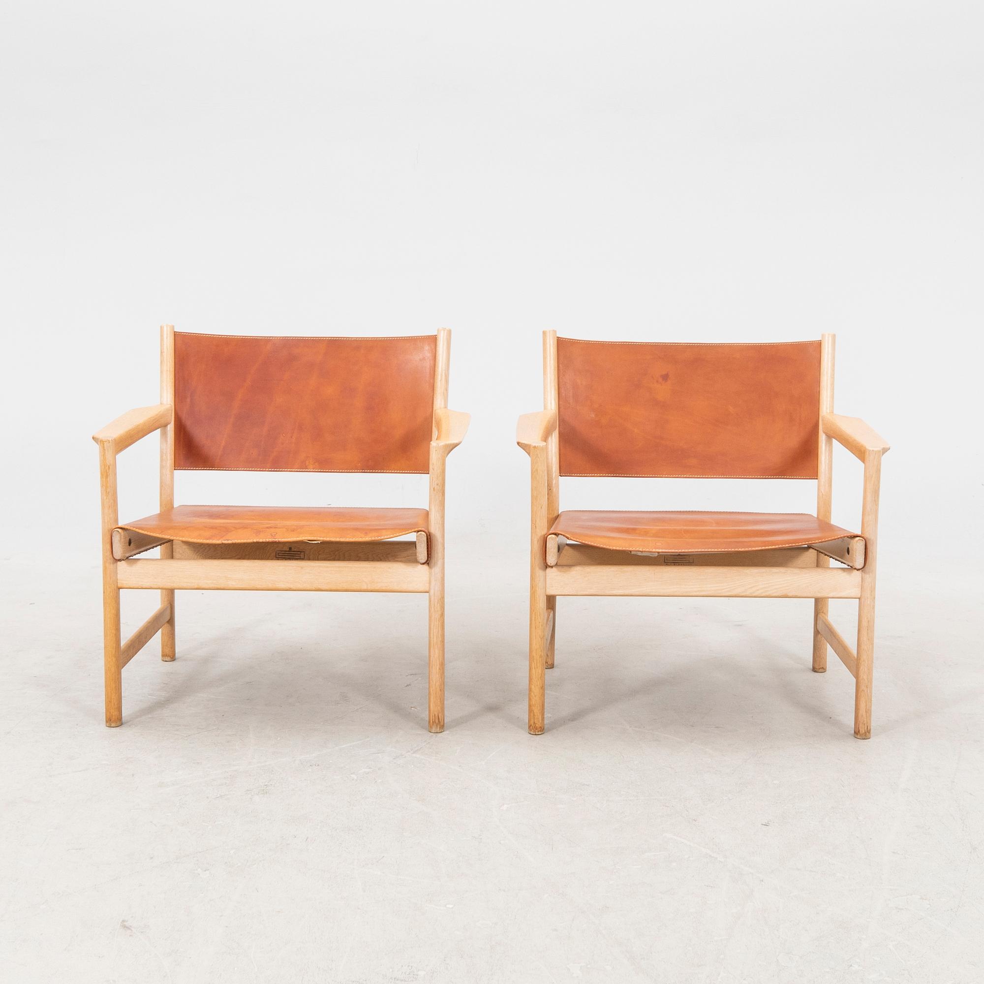 Alf Svensson, a pair of oak and leather armchairs from the second half of the 20th century.